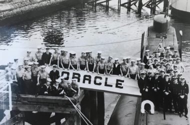 HMS Oracle alongside the quay in Londonderry 1968 (I'm in No 1 uniform, kneeling on the jetty) - David White