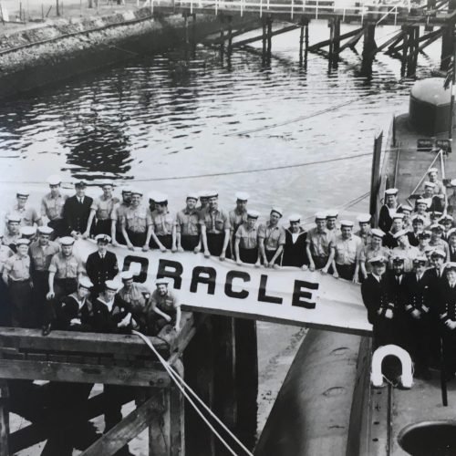 HMS Oracle alongside the quay in Londonderry 1968 (I'm in No 1 uniform, kneeling on the jetty) - David White