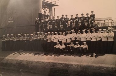 Ron Gordon and crew on side of submarine