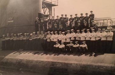 Ron Gordon and crew on side of submarine